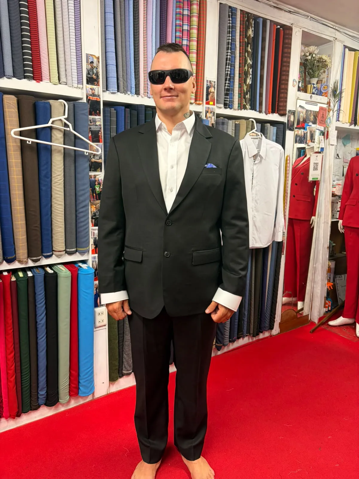 Man in a custom black suit and white shirt at Oslo Tailor, Patong